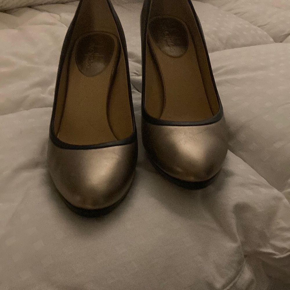 Gold and black pumps